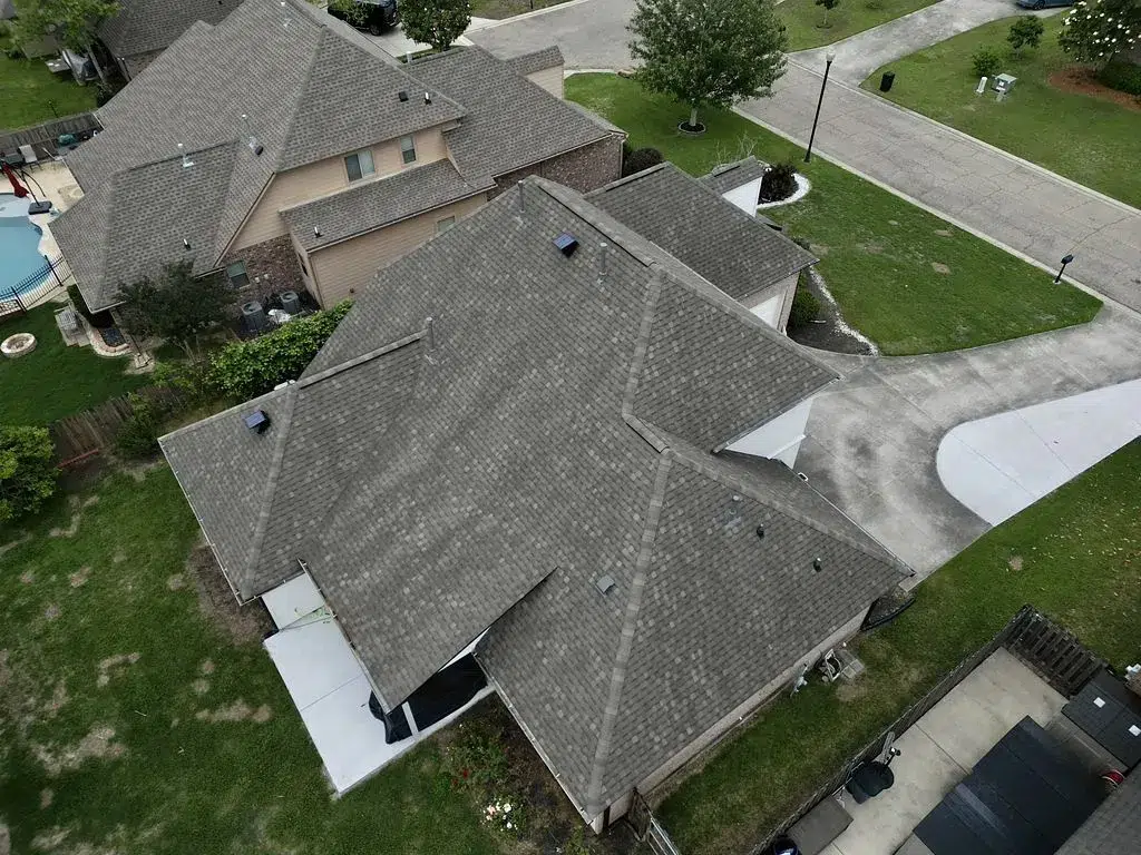 Aerial view from the back of a residential home in Baton Rouge after receiving a new shingled roof by Lifetime Roofing
