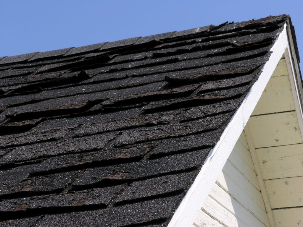shingles bent from storm damage